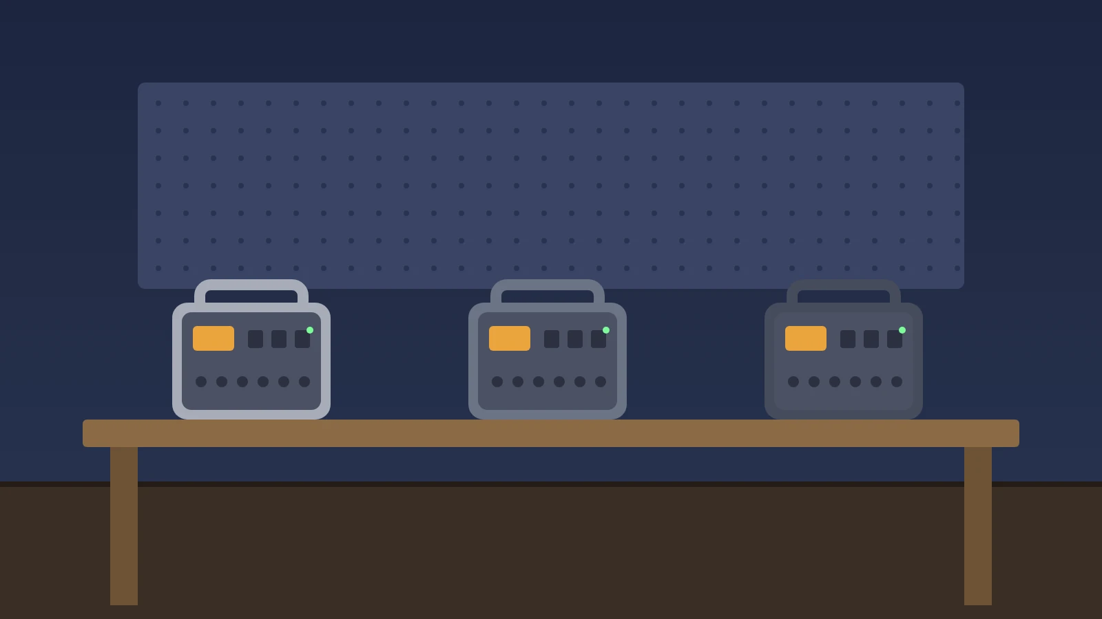 Illustration: three portable power stations side by side on a wooden workbench
